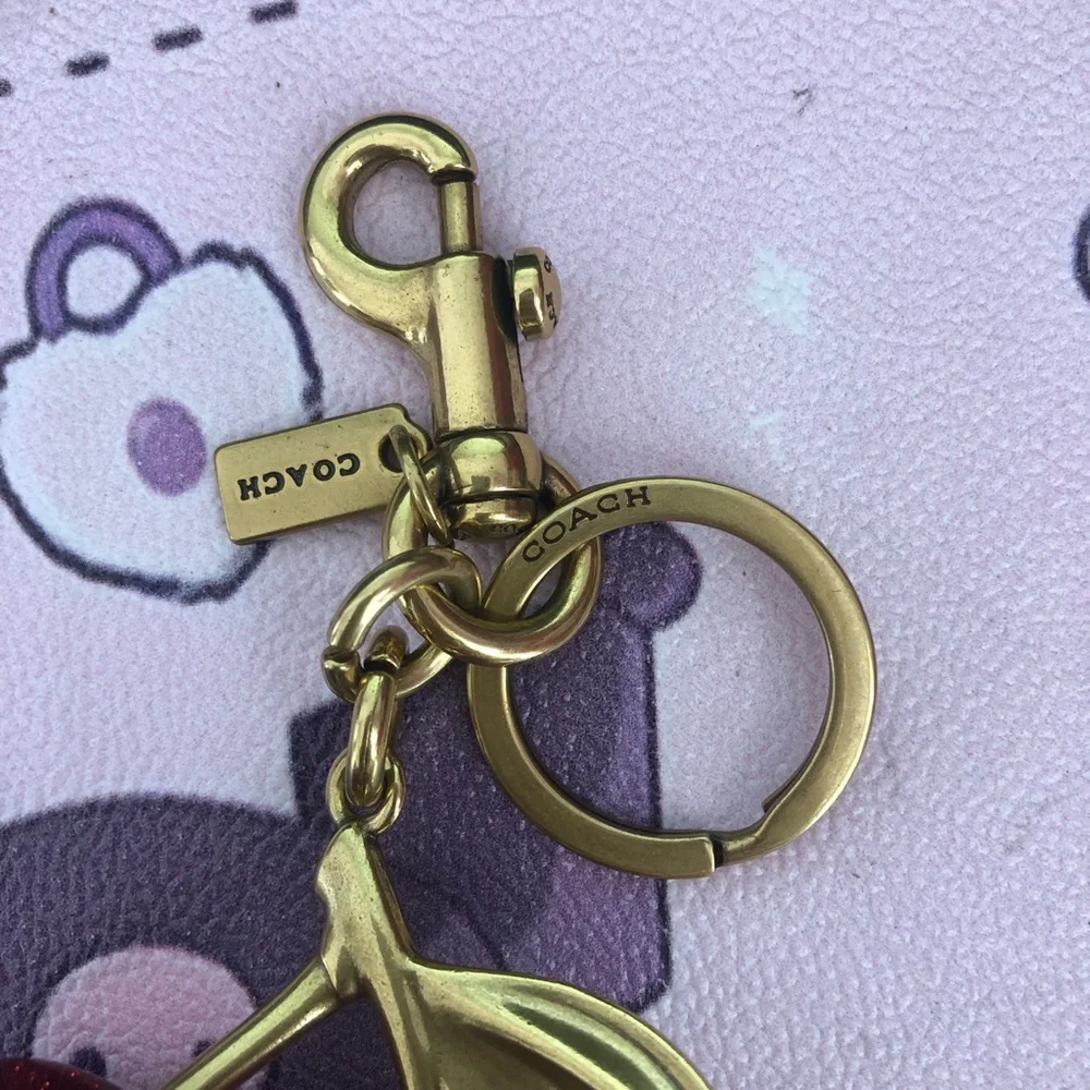 Coach keychain gold